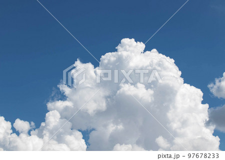 White cumulus clouds in the blue sky, illuminated by the bright spring sun. 97678233