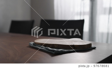 Empty olive wood board on walnut table Empty olive wood board on walnut table 97678681