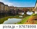 Ponte Vecchio bridge over Arno river in Florence, Tuscany, Italy. 97678998