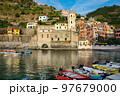 View of the bay and Church of St. Margaret of Antioch in the village Vernazza, Cinque Terre, Italy.  97679000