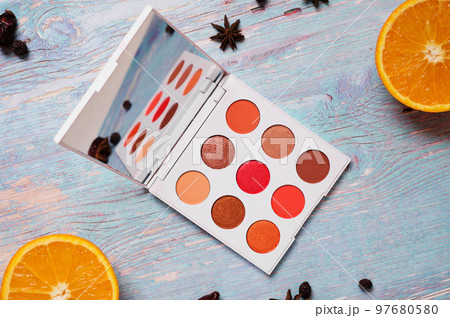 fashion summer eye palettes with  fruit and herbs at blue wooden background. close up 97680580