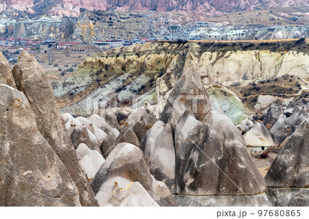 Landscape view of Unesco World Heritage, Cappadocia, Turkey under cloudy sky Landscape view of Unesco World Heritage, Cappadocia, Turkey under cloudy sky 97680865