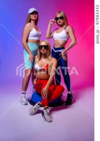 Stylish women in underwear and sunglasses in studio 97683343