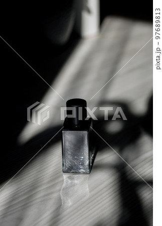 dark glass perfume bottle. dark glass perfume bottle. 97689813