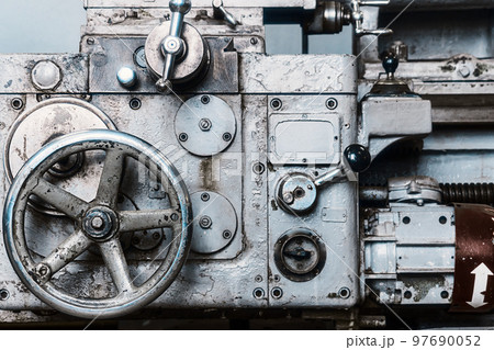Old lathe for metal processing. Type of metal machine parts in lathe shop at factory. Industrial Old lathe for metal processing. Type of metal machine parts in lathe shop at factory. Industrial 97690052