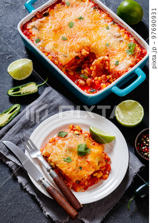 enchilada casserole with veggies, corn, pinto bean enchilada casserole with veggies, corn, pinto bean 97690931