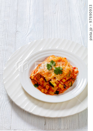 enchilada casserole with veggies, corn, pinto bean 97690933