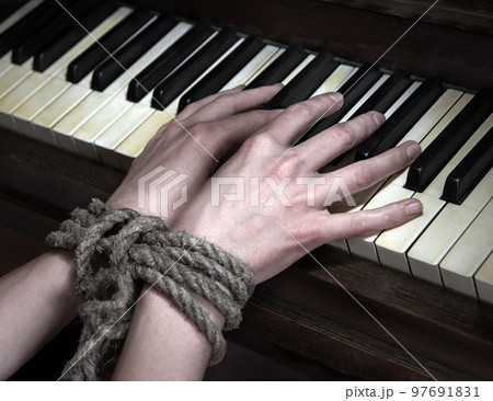 Play the piano with hands tied Play the piano with hands tied 97691831