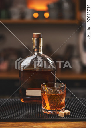 Old fashioned cocktail on table 97692756