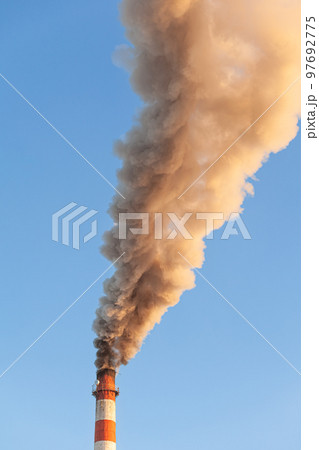 White thick smoke from the boiler room chimney. Industrial zone. White thick smoke from the boiler room chimney. Industrial zone. 97692775