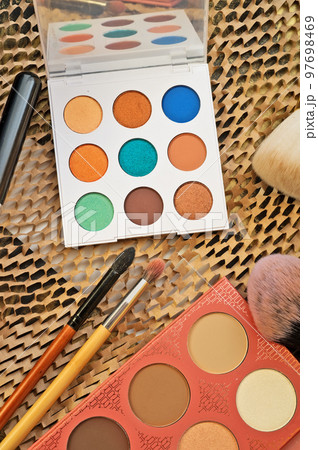 fashion set of new cosmetics palettes with  brushes. close up 97698469