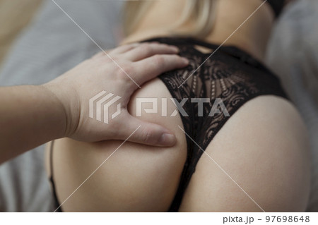 foreplay and sex. Man's hand caressing woman's buttocks foreplay and sex. Man's hand caressing woman's buttocks 97698648