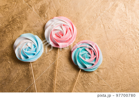 A three vegetarian aquafaba meringue candy on a stick 97700780