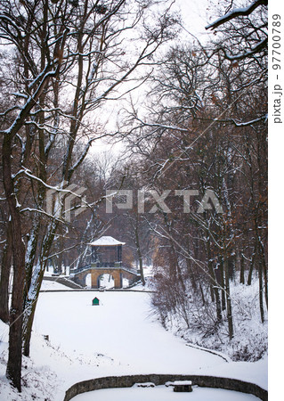 snow-covered Chinese bridge and lake in Oleksandria Park, Ukraine 97700789