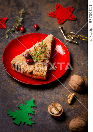 A piece of grated nut cake in a Christmas decoration 97700811
