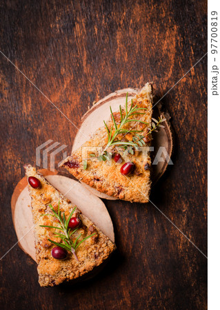 Two pieces of grated pie on wooden plates Two pieces of grated pie on wooden plates 97700819