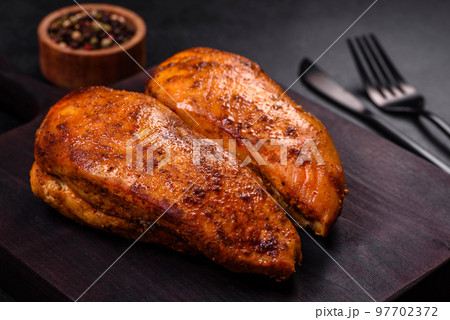 Delicious grilled chicken fillet with spices and herbs 97702372