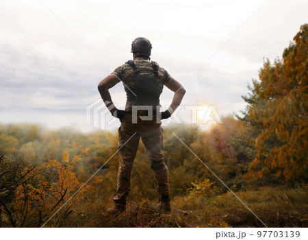 Sad soldier look to the sky 97703139