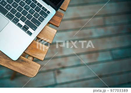 Modern laptop on the wooden table, top view, copy space. 97703389