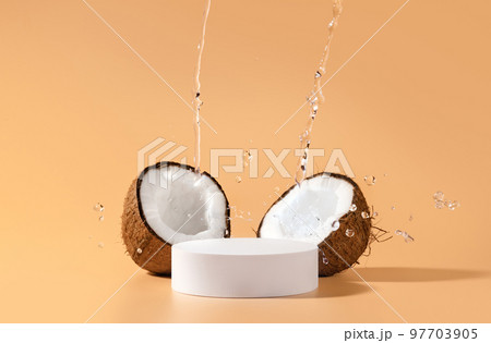 Coconuts product design. Beauty skincare scene for cosmetic product presentation made with mockup round scene, coconuts and tropical water splash. 97703905