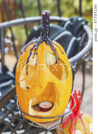 pumpkin with face and candle for Halloween 97704190