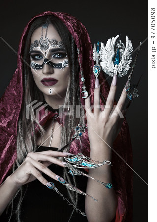 Beautiful woman with art makeup, creative long nails. Design manicure. Beauty face. Beautiful woman with art makeup, creative long nails. Design manicure. Beauty face. 97705098