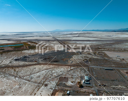 Pile of colorful discarded cars on junkyard in a desert in the USA. 97707610