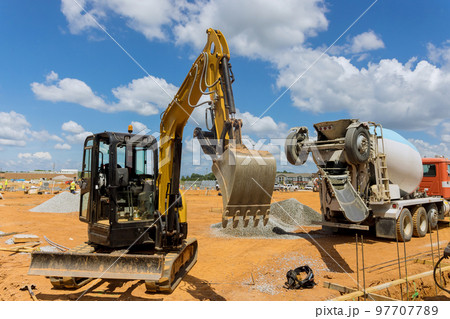 In construction site is being worked with heavy construction equipment In construction site is being worked with heavy construction equipment 97707789