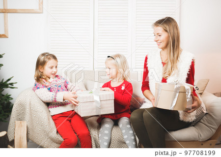 holidays, presents, christmas, x-mas, birthday concept - happy mother and child girl with gift box 97708199