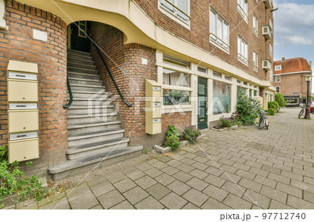 View of street near building with beauty of vagitaion outside 97712740