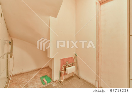 Fragment of interior of modern white bathroom with wooden cabinet under sink and with mirror and towel Fragment of interior of modern white bathroom with wooden cabinet under sink and with mirror and towel 97713233