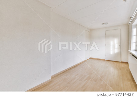 Plastic window and radiator on white wall in empty light room at home 97714427