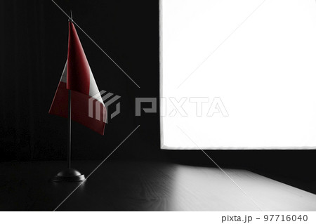 Small national flag of the Peru on a black background 97716040