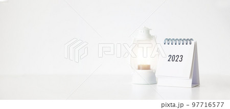 New year 2023 business calendar and lamp on office table in new year day. Make a work plan for the start of the year. Concept about Celebration, Business, Christmas, New Year. 97716577