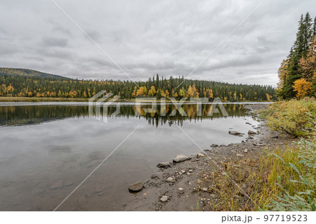 camping caravan near river autumn fall landscape along Ammarnas National Park in Lapland Sweden camping caravan near river autumn fall landscape along Ammarnas National Park in Lapland Sweden 97719523