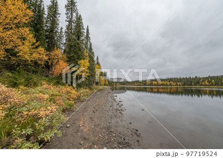 camping caravan near river autumn fall landscape along Ammarnas National Park in Lapland Sweden 97719524