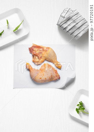 Chicken thighs on a kitchen with some herbs Chicken thighs on a kitchen with some herbs 97720191