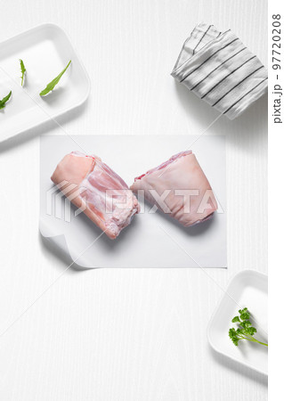 Pork knuckles on a kitchen with some herbs Pork knuckles on a kitchen with some herbs 97720208