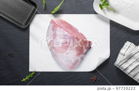 Pork ham on a flat lay of a kitchen with various items Pork ham on a flat lay of a kitchen with various items 97720222