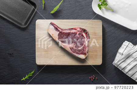 Beef steak on a flat lay of a kitchen with various items Beef steak on a flat lay of a kitchen with various items 97720223