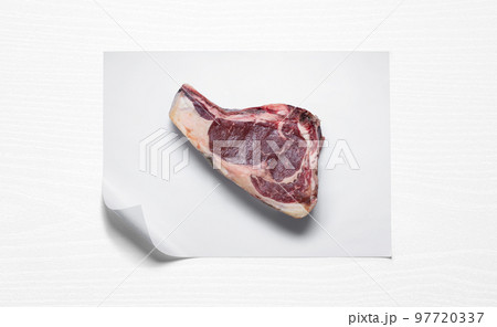 Beef steak over butcher paper Beef steak over butcher paper 97720337