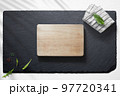Empty cutting board with various food items 97720341