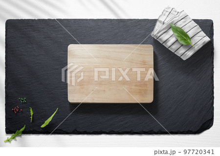 Empty cutting board with various food items Empty cutting board with various food items 97720341