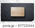 Cutting board against a slate plate 97720344