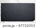 Slate plate against white wood flat lay 97720353