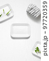 Flat lay of a kitchen with styrofoam containers and herbs 97720359