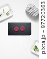 Mini beef burguers on a kitchen with some herbs 97720363