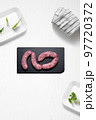 Criollo chorizo on a kitchen with some herbs 97720372
