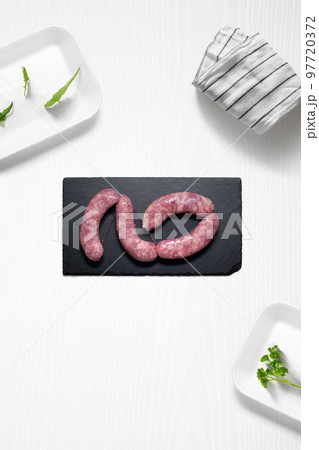 Criollo chorizo on a kitchen with some herbs Criollo chorizo on a kitchen with some herbs 97720372