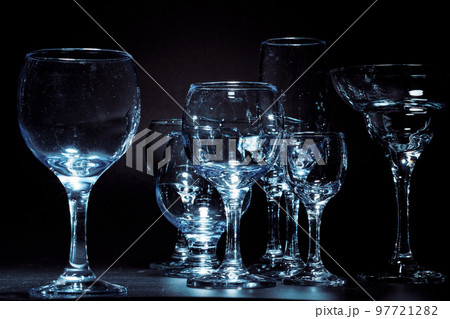 Empty glasses for drinks on dark background 97721282